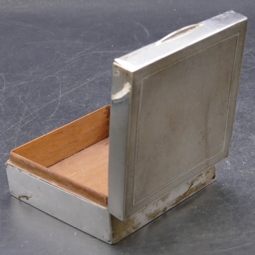 473 - A Birmingham square silver cigarette box with engine turned hinged lid enclosing cedar lined interio... 