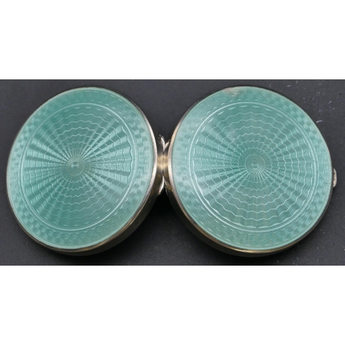 482 - A George V silver and pale green enamelled circular compact enclosing mirror, Birmingham 1929, maker... 