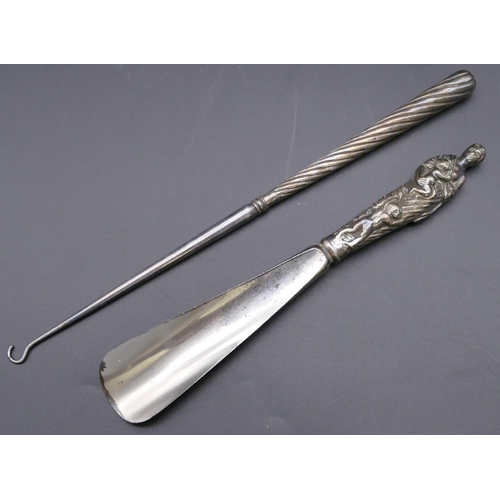 484 - A Victorian silver handled shoehorn in the form of a mother with 3 children, London 1887 and a Birmi... 