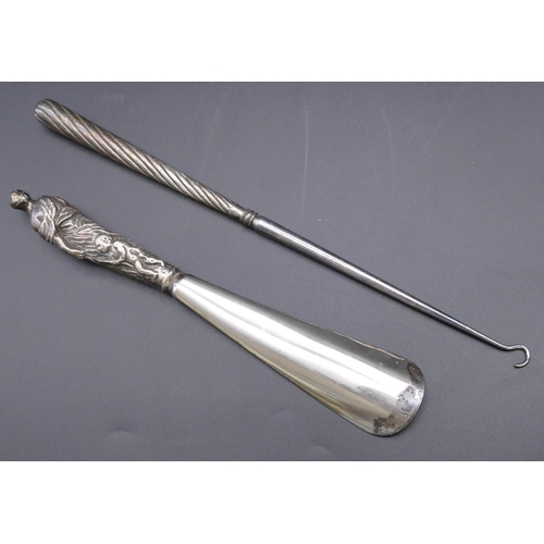 484 - A Victorian silver handled shoehorn in the form of a mother with 3 children, London 1887 and a Birmi... 