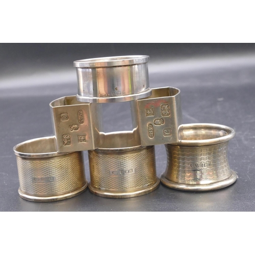 487 - A pair of plain Birmingham silver rectangular shaped napkin rings, maker's mark J.H&S, with engraved... 