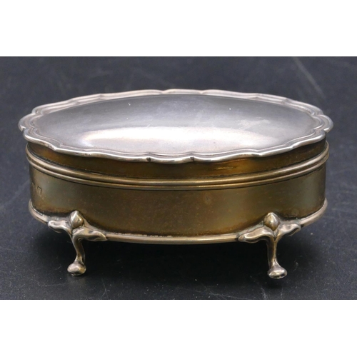 489 - A Birmingham silver trinket box with scallop shaped hinged top enclosing silk interior on splayed fe... 