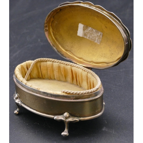 489 - A Birmingham silver trinket box with scallop shaped hinged top enclosing silk interior on splayed fe... 