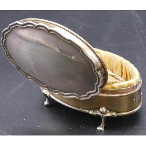 489 - A Birmingham silver trinket box with scallop shaped hinged top enclosing silk interior on splayed fe... 