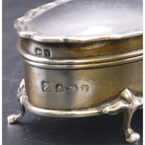 489 - A Birmingham silver trinket box with scallop shaped hinged top enclosing silk interior on splayed fe... 