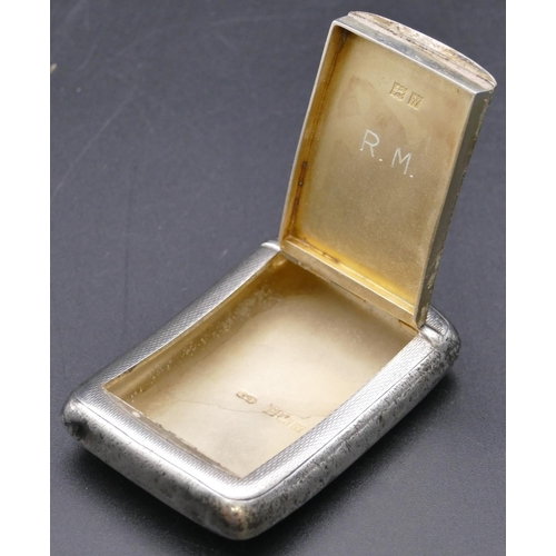 490 - A Birmingham silver concave shaped snuff box with allover engine turned decoration and hinged top, B... 