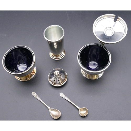 498 - A 3-piece modern London silver condiment set, mustard pot with blue glass liner, salt with blue glas... 