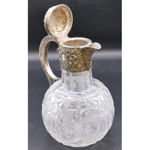 501 - A late Victorian cut glass round bulbous shaped claret jug with silver neck, scroll handle and hinge... 