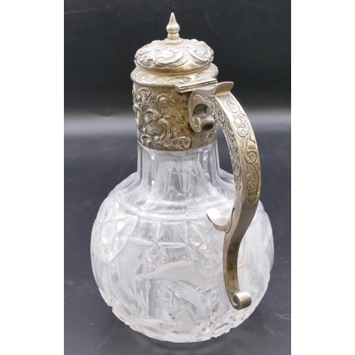 501 - A late Victorian cut glass round bulbous shaped claret jug with silver neck, scroll handle and hinge... 