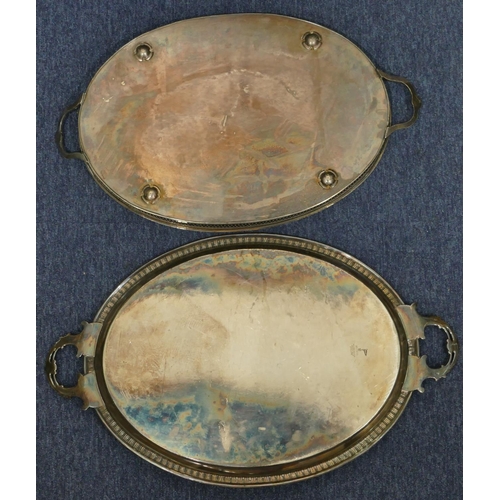 503 - A Walker & Hall silver plated oval tray with engraved decoration, 65cm wide and another silver plate... 