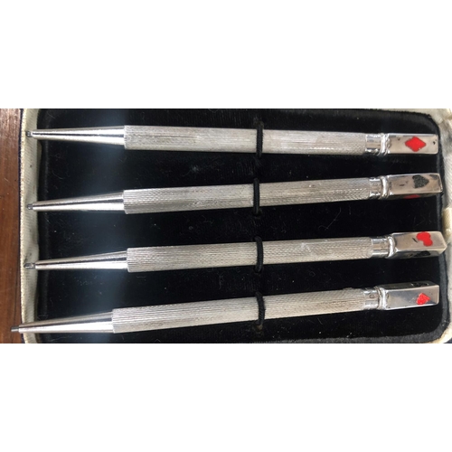 507 - A set of 4 Sterling silver bridge propelling pencils with engine turn decoration and enamelled card ... 