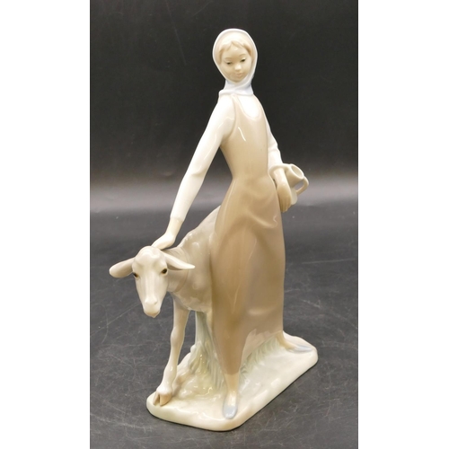 6 - A Lladro figure of a standing lady with goat, 28cm high