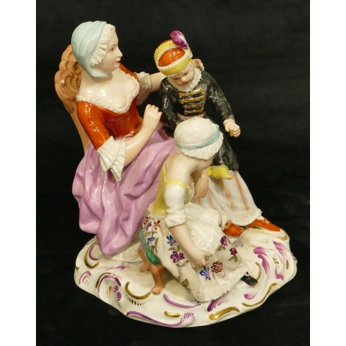 62 - A Vienna porcelain group of a seated lady with 2 children (lady's waist and girl in black dress arm ... 