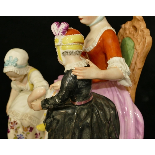 62 - A Vienna porcelain group of a seated lady with 2 children (lady's waist and girl in black dress arm ... 