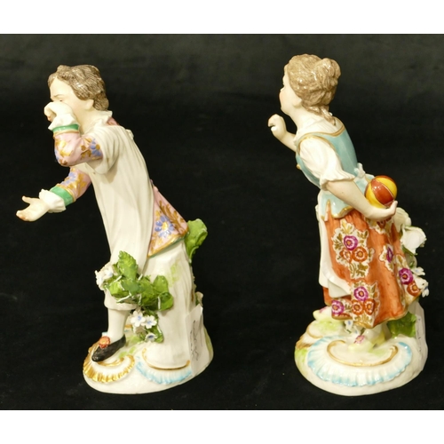 63 - A pair of Chelsea Derby porcelain figures of young gentleman and lady playing catch (both have branc... 