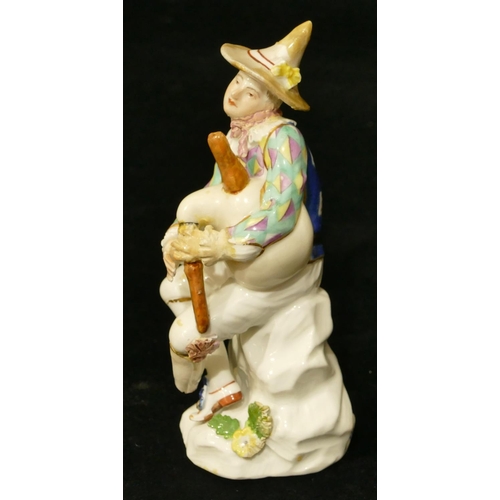 66 - A Meissen figure of a seated jester playing a bagpipe (hat, neck, left hand and right fingers, bagpi... 