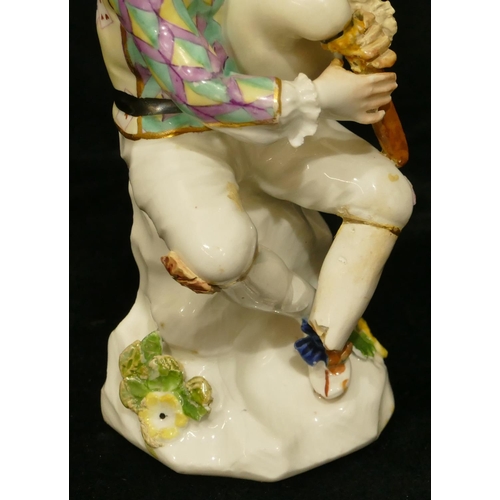 66 - A Meissen figure of a seated jester playing a bagpipe (hat, neck, left hand and right fingers, bagpi... 