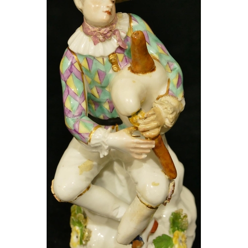 66 - A Meissen figure of a seated jester playing a bagpipe (hat, neck, left hand and right fingers, bagpi... 