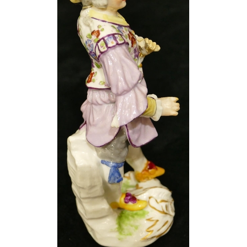 67 - A Meissen figure of a standing gentleman in puce jacket (plume to hat missing, chip to back of hat, ... 