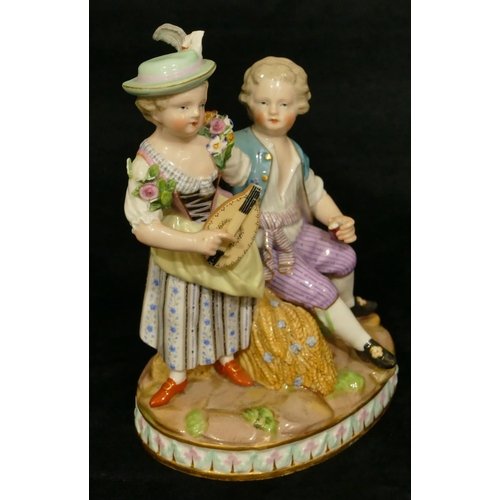 68 - A Meissen group of seated boy and standing girl playing mandolin (part to plumage, end to mandolin, ... 