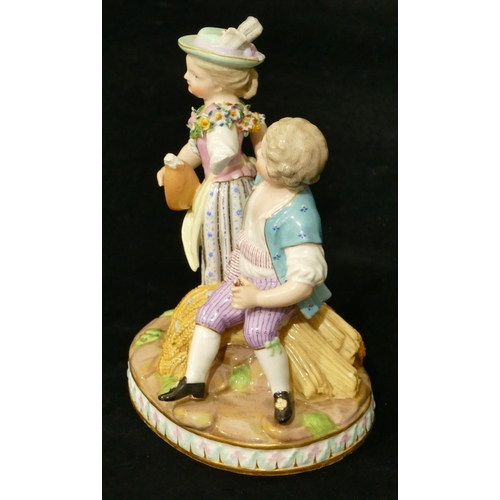 68 - A Meissen group of seated boy and standing girl playing mandolin (part to plumage, end to mandolin, ... 