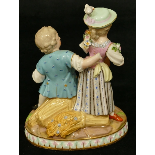 68 - A Meissen group of seated boy and standing girl playing mandolin (part to plumage, end to mandolin, ... 