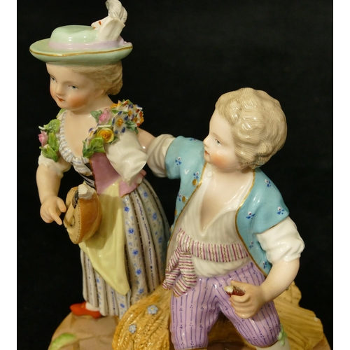 68 - A Meissen group of seated boy and standing girl playing mandolin (part to plumage, end to mandolin, ... 