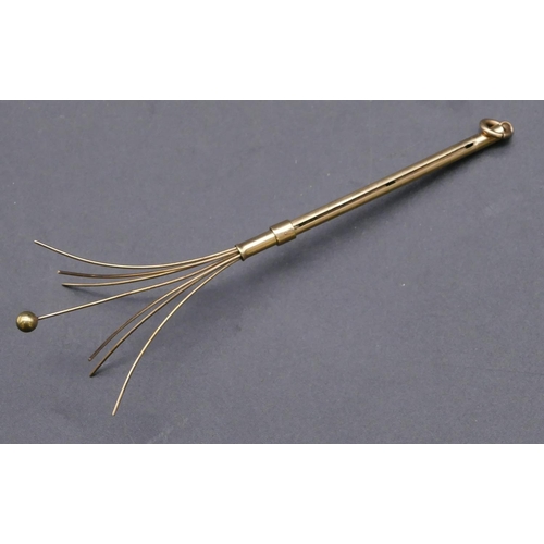 712 - A gold swivel stick, 5.37 grams gross (boxed)