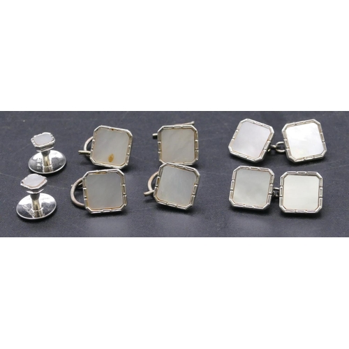 714 - A pair of gentleman's square sterling silver cufflinks with Mother of Pearl decoration complete with... 