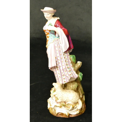 72 - A Meissen figure of a standing lady with sheep at her feet (part tree stump, lamb's left hoof and le... 