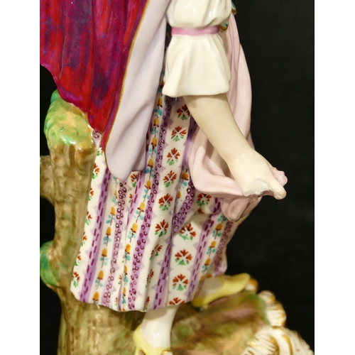 72 - A Meissen figure of a standing lady with sheep at her feet (part tree stump, lamb's left hoof and le... 