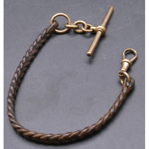 720 - A leather fob with 9ct gold clip end and mounted with 9ct gold T-bar