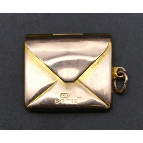 729 - A 9ct gold pendant in the form of an envelope, 3.8 grams (with engraved monogram)