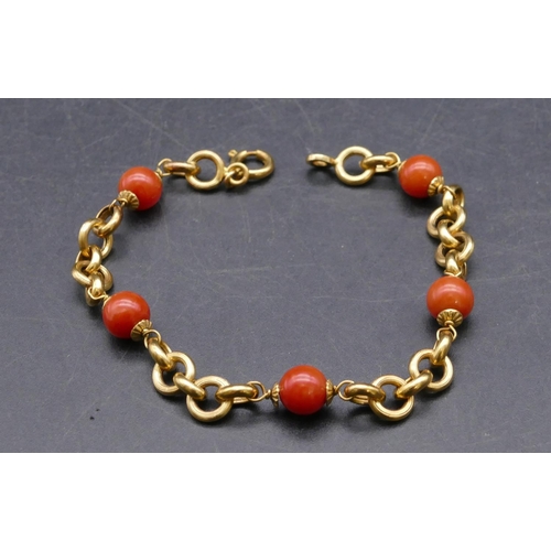 734 - An 18ct gold and coral bead bracelet, 20cm long, 7.9 grams gross