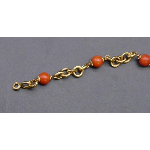 734 - An 18ct gold and coral bead bracelet, 20cm long, 7.9 grams gross