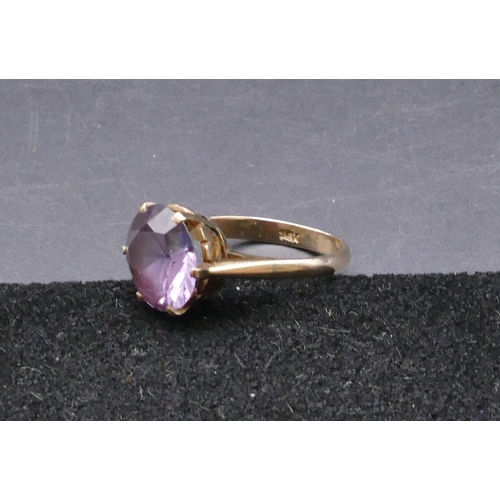 747 - A 9ct gold ladies' ring set with circular amethyst, size P/Q, 3.2 grams gross