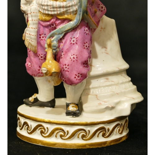 75 - A Meissen figure of a young boy riding a hobby horse whilst holding a twisted stick (legs to hobby h... 