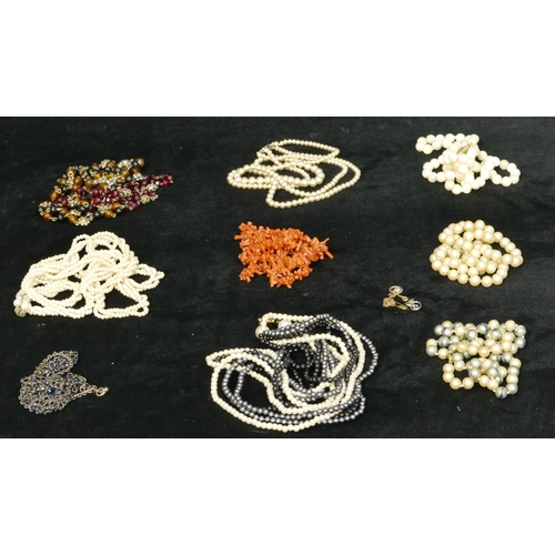 763 - A Mother of Pearl bead necklace and a quantity of various other necklaces including coral etc.