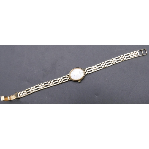 778 - A 9ct gold ladies' Rotary Elite wrist watch with matching strap bracelet, white enamel dial, overall... 