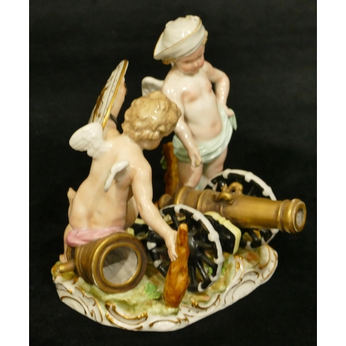 78 - A Meissen group of 2 Cupids standing either side of a canon, (touch light stick missing end and plum... 