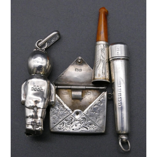 787 - A Scottish silver rattle in the form of a baby, a small Birmingham silver pendant in the form of an ... 