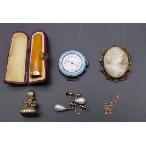 791 - A silver circular wristwatch with pale blue enamelled rim (slight chip to rim), an amber cheroot hol... 