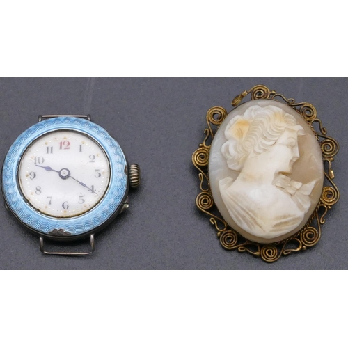 791 - A silver circular wristwatch with pale blue enamelled rim (slight chip to rim), an amber cheroot hol... 