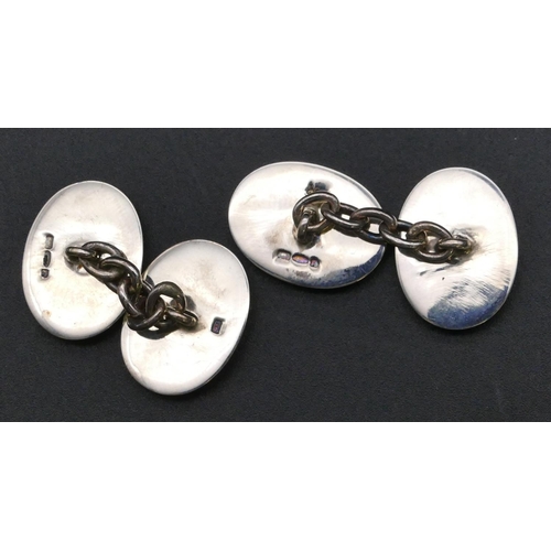 792 - A pair of silver oval hockey cufflinks with pale blue and green enamel decoration (boxed)