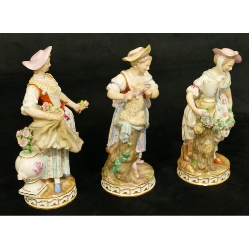 80 - A set of 3 Meissen figures of standing ladies (lady standing next to pedestal flowers missing from v... 