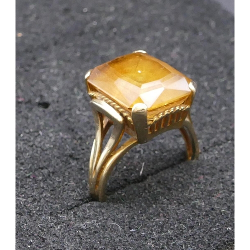 803 - A 9ct gold rectangular shaped ring set with yellow coloured stone, size L, 5.4 grams