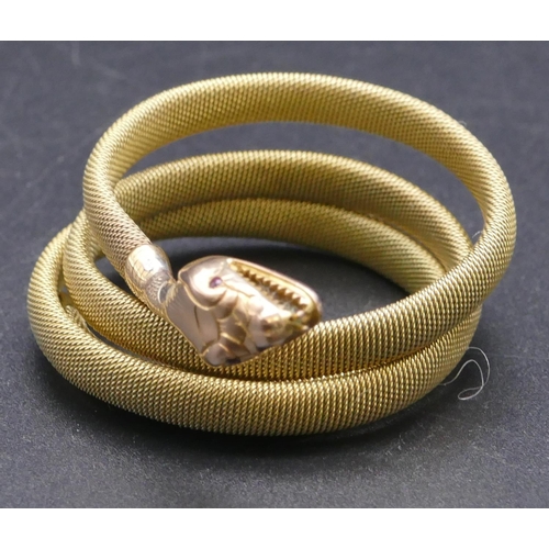 807 - A 9ct gold serpent bangle with entwined body, 20.2 grams gross