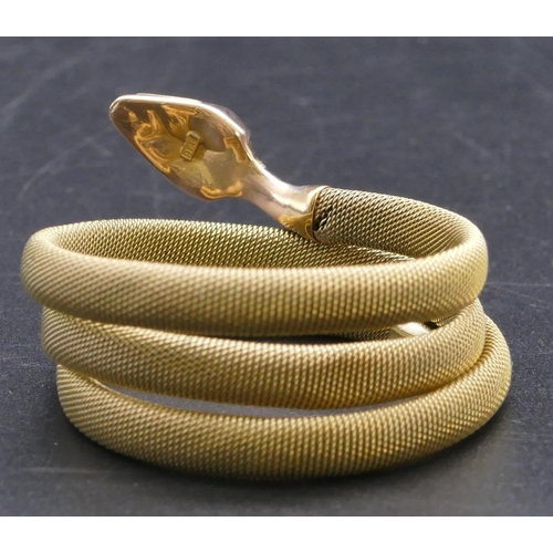 807 - A 9ct gold serpent bangle with entwined body, 20.2 grams gross