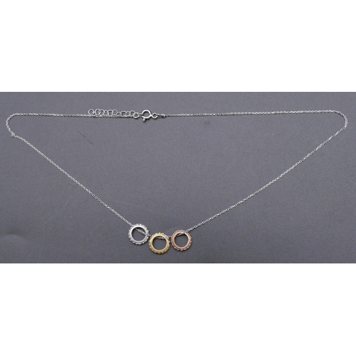 811 - A 925 silver chain mounted with 3 circles and inset with clear stones.