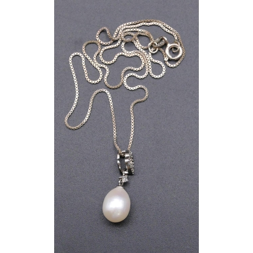 813 - A drop pendant with single pearl and clear stones on 925 square linked chain.